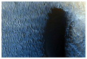 Bright Circular Feature with Superposed Dark-Toned Material