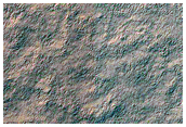 Exposure of Polar Layered Deposits Not Observed by MGS