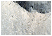 Youthful Crater Superimposed on Volcanic Plain