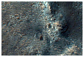 Light-Toned Material on Crater Floor near Ladon Valles Basin