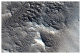 Uitwaaierende kanalen in Tantalus Fossae