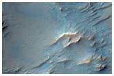 Possible Low-Calcium Pyroxene Outcrops South of Huygens Crater