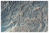 Rugged Banded Material in Crater in Northwest Hellas Planitia