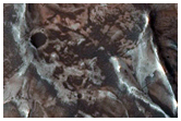 Alluvial Fan in Large Crater with Possible Phyllosilicate Ejecta