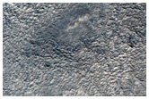 Tempe Terra Crater with Adjacent Mound and Graben