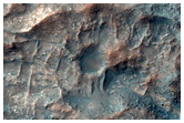 Possible Low-Calcium Pyroxene Outcrop in Wall of Crater Near Huygens Crater