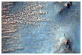 Two Impact Craters Exposing Bedrock