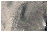 Channels and Circular Depression in Phison Rupes Region