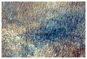 Erosion into Layered Sediments in Charitum Montes