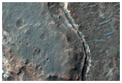 Exposures of Light-Toned Layered Material along Ladon Valles Floor