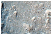 Layered Terrain in and Out of Crater in Northwest Hellas Planitia