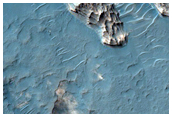 Layered Light-Toned Crater-Filling Material in Northwest Hellas Region