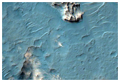 Layered Light-Toned Crater-Filling Material in Northwest Hellas Region
