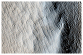 Dust Covered Channels on Tharsis Tholus