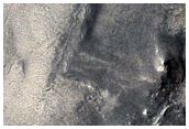 Channels and Circular Depression in Phison Rupes Region