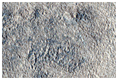 Channels Cutting Across Deposit in Crater in Arabia Terra