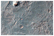 Light-Toned Layered Deposits Exposed along Ladon Valles Floor