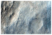 Landform with Digitate Ridges and Superimposed Crater in Amenthes Region