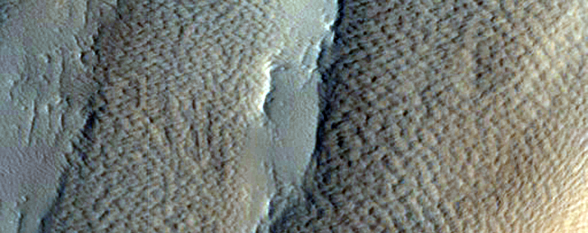 Curved Line of Pits in Northern Mid-Latitudes