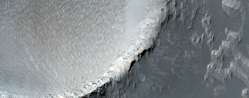 Flow Banked against Raised Crater Rim in THEMIS Image I37856002