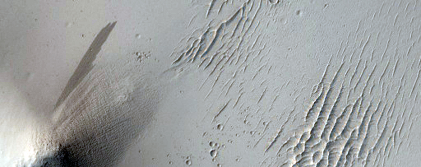 Meandrada tereno proksime al kratero en Terra Sabaea