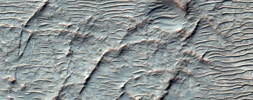 Semi-Rectilinear Ridge Pattern in Light-Toned Material in Basin