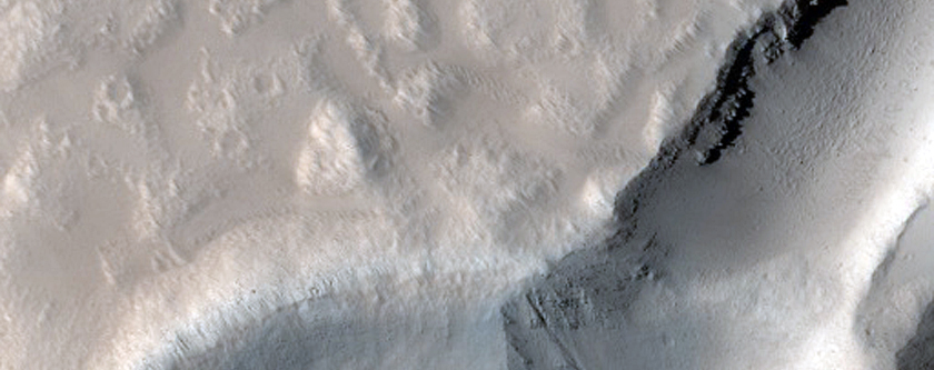 Crater Cut by Graben in Tantalus Fossae