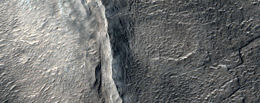 Fractures in Old Crater Deposit in Northern Mid-Latitudes