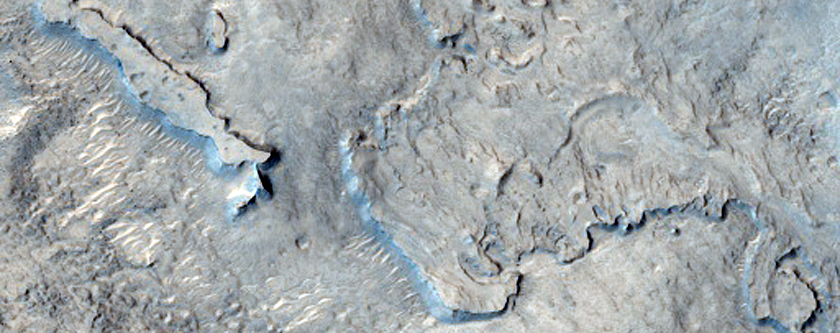 Layers in Eroded Crater Southwest of Bamberg Crater