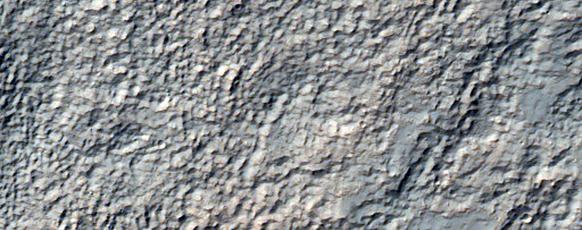 Pit with Well-Exposed Layered Bedrock North of Hellas Region