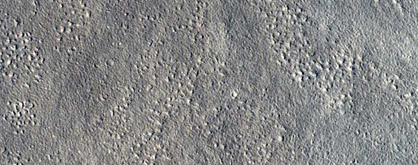 Mid-Latitude Crater with Dark Spot in Middle