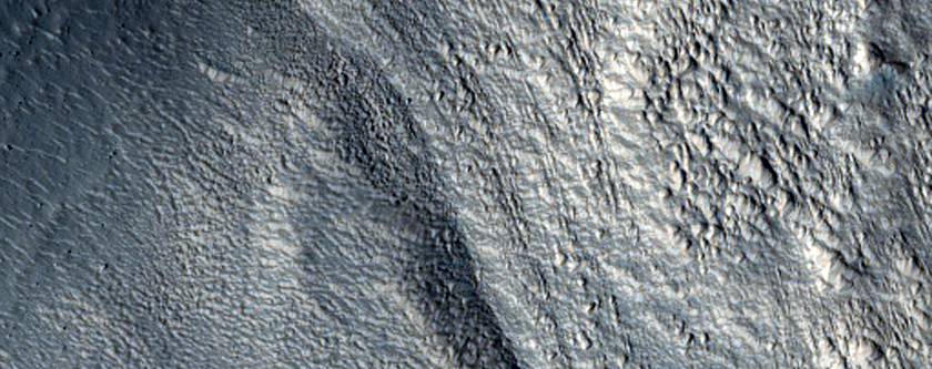 Valleys with Steep Walls on Moreux Crater Rim