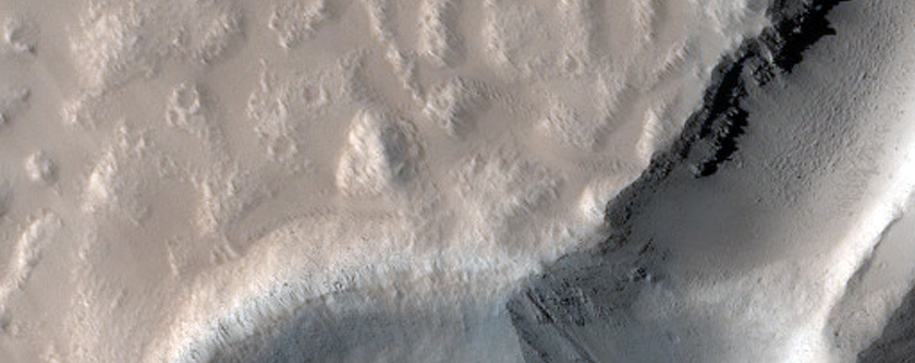 Crater Cut by Graben in Tantalus Fossae