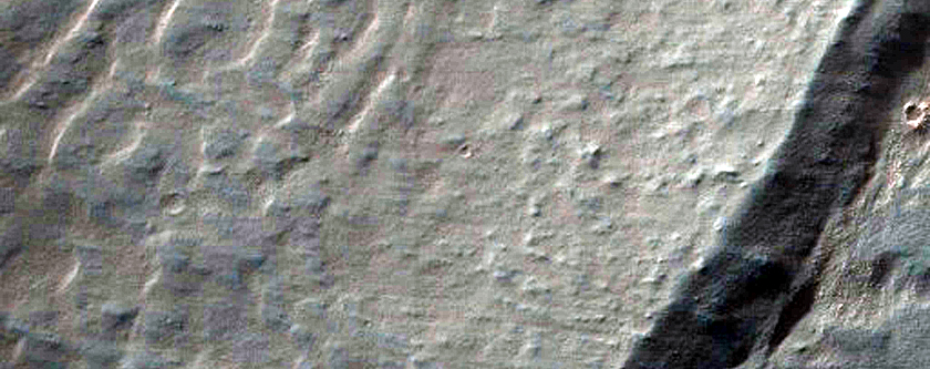 Light-Toned Deposits along Coprates Chasma Wallrock Slopes