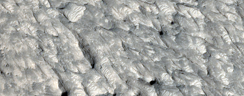 Обтекаемые формы рельефа на плато Aeolis Planum