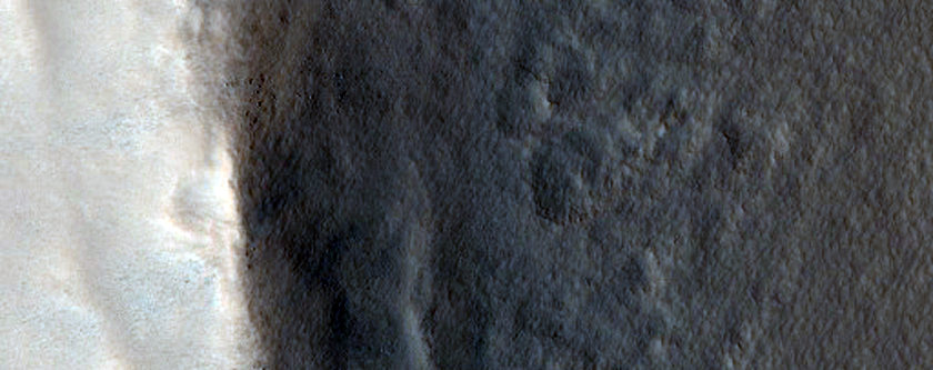 Western Rim of Well-Preserved Crater on Northern Plains