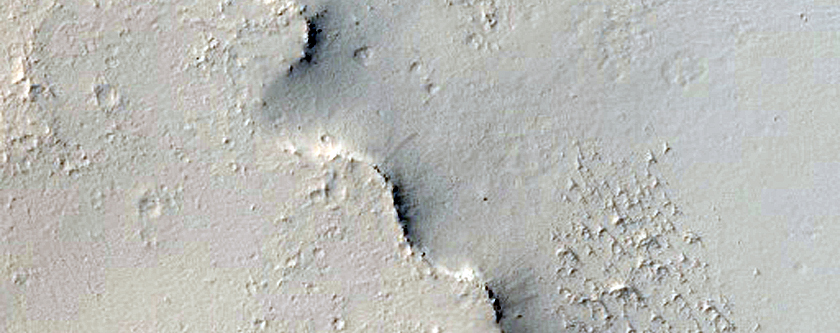 Small Crater with Cliff East of Henry Crater