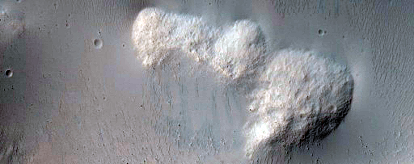 Impact Crater Exposing Bedrock
