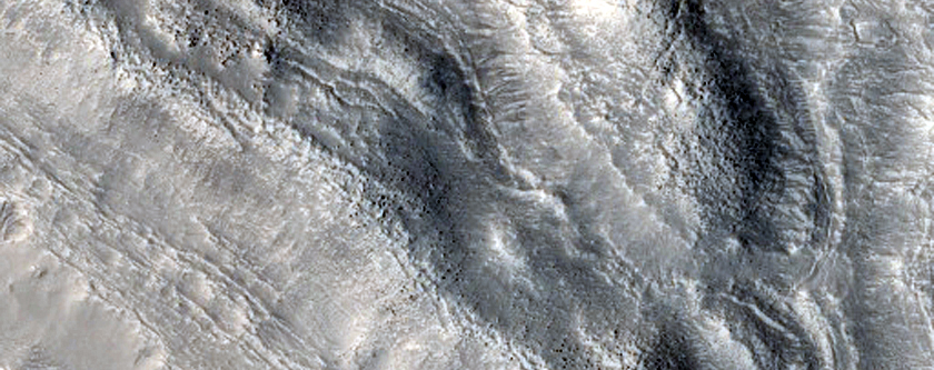 Ridges and Troughs in Crater Ejecta inside Cerulli Crater