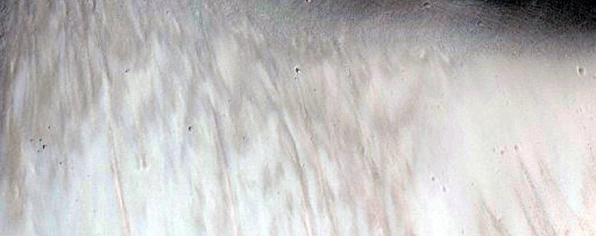 Impact Crater Exposing Bedrock Layers