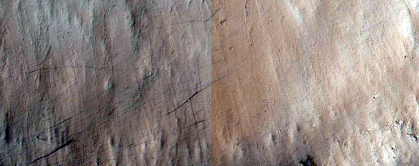 Crater in Lava Plains West of Echus Chasma