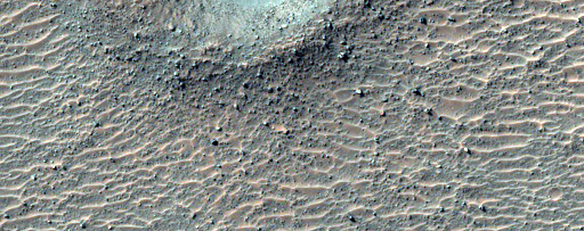 Small Recent Impact Crater on Floor of Larger Crater