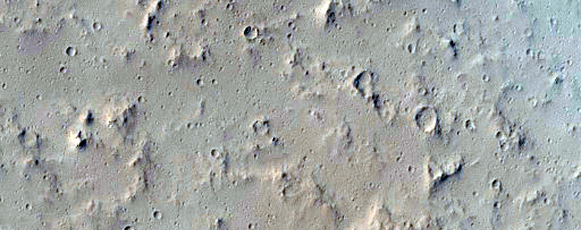 Lava Flow and Impact Crater East of Tharsis Tholus