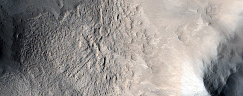 Impact Crater with Central Pitted Peak