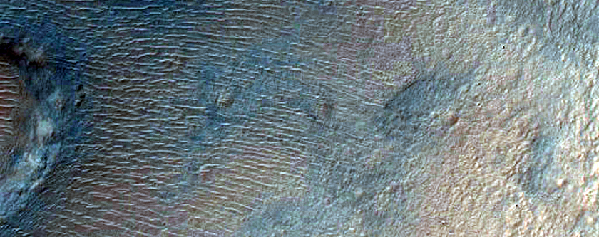Impact Crater Exposing Bedrock