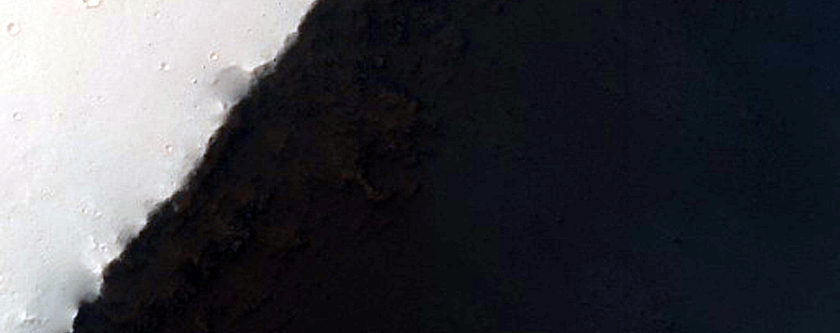 Exposure of Fine Strata and Flow Features at Ius Chasma