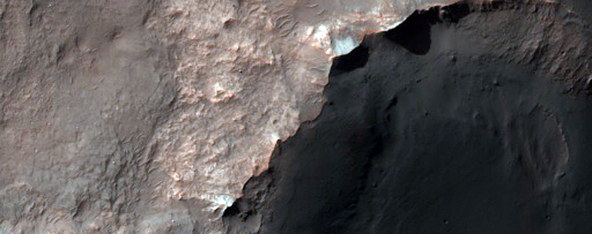 Light-Toned Rock Outcrops on Northwest Rim of Buta Crater