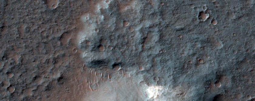 Cone with Summit Pit and Associated Flow-Like Feature in Coprates Chasma