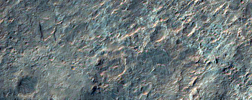 Light-Toned Layered Deposits at Terminus of Ladon Valles