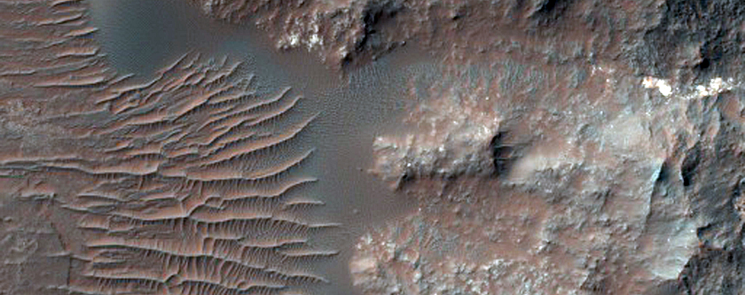 Central Pit of 38-Kilometer Crater Superimposed on Rim of Vinogradov Crater